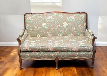 Vintage Louis XV Style Settee With Intricate Carved Wood Frame And Custom Floral Upholstry