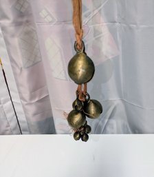 Vintage Handcrafted Cluster Of Multiple Sized Tied Bronze Cow Bells