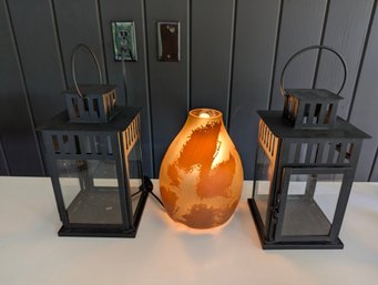 Distressed Amber Glass Accent Lamp With Twin Black Metal Lanterns