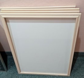 Four Laminated Wood Frames With Light Pink Tint