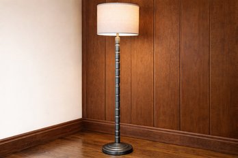 Stacked Spool Metal Floor Lamp With A Natural Linen Drum Shade