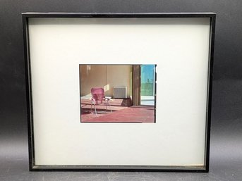 A Pink Lawn Chair And A Radiator