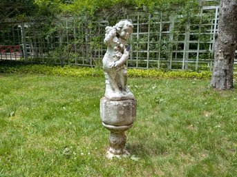 Concrete Garden Statue Of A Cherub On A Stone Plinth