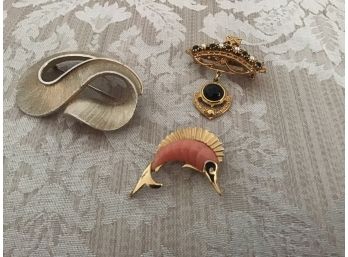 Three Gold Tone Pins Including A Swordfish, A Crown, Etc.