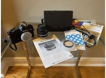 VINTAGE NIKON FE 35MM CAMERA BODY 50MM LENS CARRYING CASE AND ACCESSORIES