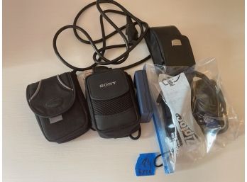 Lot Of Assorted Cameras, Cases And Chargers.