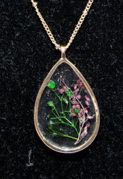 Resin Teardrop Pendant Necklace Features Real Pressed Flowers Preserved Within A Gold-colored Frame