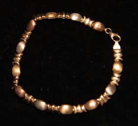 10K Gold Vintage Tri-color Gold 'X And O' Hugs And Kisses Link Bracelet. 3.48 Grams