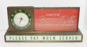 Vintage 1950s Coca-Cola Lighted Advertising Counter Clock And Sign Featuring A Clock Face On The Left, A 'Drin