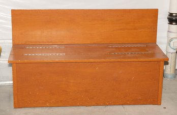 Wooden Storage Bench With A High Backrest And A Hinged Seat That Opens For Compartment Access