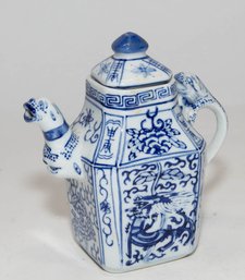 Vintage Chinese Porcelain Teapot Featuring A Blue And White Dragon Motif