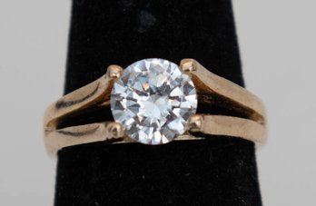 Yellow Gold Plated Ring Features A Single, Round-cut Cubic Zirconia Stone In An Open Shank Design.
