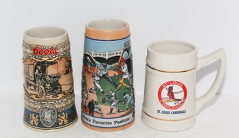 Three Collectible Coors, Budweiser And St. Louis Cardinals Beer Steins