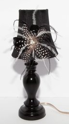 Black Table Lamp With Black Shade Adorned With Spotted Feathers