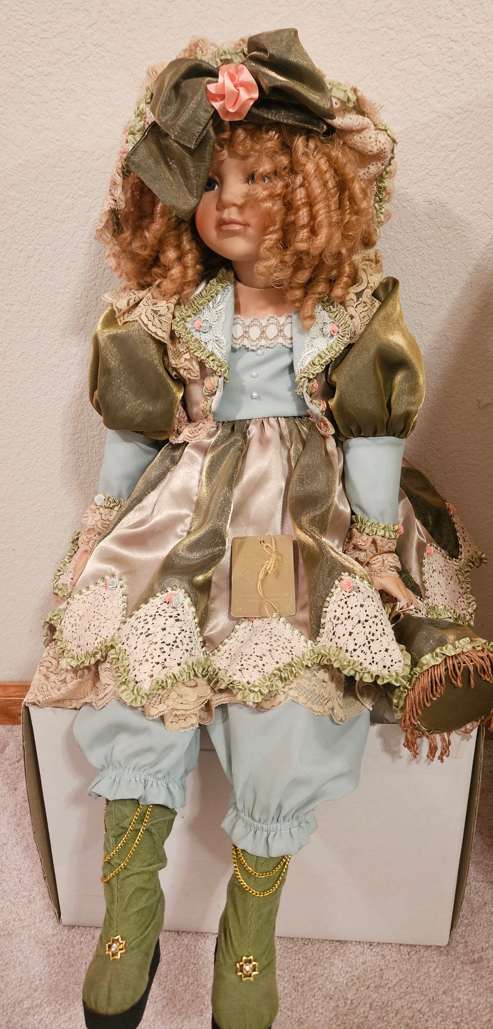 porcelain doll green dress Vintage porcelain doll with green dress and chair 29769