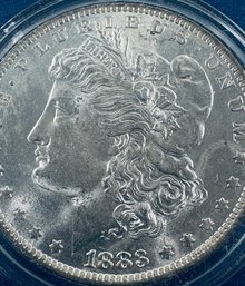 1883-O MORGAN SILVER DOLLAR COIN - BU/BRILLIANT UNCIRCULATED - IN PLASTIC CAPSULE