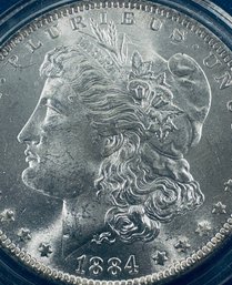 1884-O MORGAN SILVER DOLLAR COIN - BU/BRILLIANT UNCIRCULATED - IN PLASTIC CAPSULE