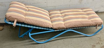 Vintage Chaise Lounge With Blue Metal Frame And Striped Cushion With Straps