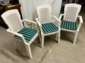 Trio Of White Plastic Outdoor Stackable Chairs With Removable Green Striped Cushions