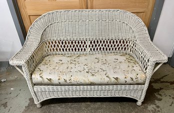 Vintage White Wicker Sofa With Floral Cushion