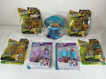 Seven PEZ Dispensers Themed Around Teenage Mutant Ninja Turtles, My Little Pony, Finding Dory