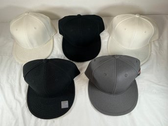 Five Baseball Caps, One Is Duckies, One Has City Hunter Sticker