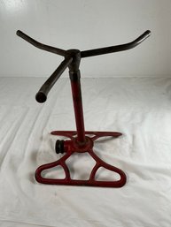 Vintage Lawn Sprinkler Features A Three-arm Rotating Design Constructed From Cast Iron And Brass