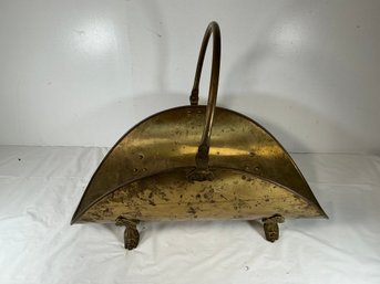 Vintage Brass Fireplace Log Holder Features Ornate Claw Feet And A Curved Handle