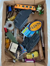 Mix Of Miscellaneous Items, Primarily Everyday Carry Gear, Toys, And Small Personal Belongings
