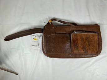 Brown Leather Wristlet Features A Distinct, Textured Cowhide Pocket On The Front By Goldbeater, Inc