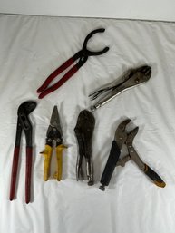 Several Locking Pliers, Such As A Vice-Grip And A Smaller Locking C-clamp