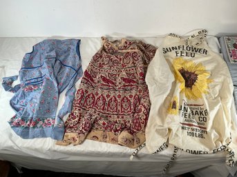 Three Aprons In Different Patterns