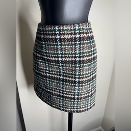 H&M Houndstooth Mini Skirt Featuring A Green, Brown, And Black Pattern With An Exposed Back Zipper.