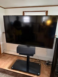 Black Rolling Glass Base TV Stand With Speaker Shelf (Speaker And TV Sold Separately)