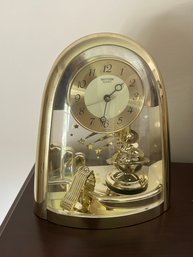 Rhythm Quartz Desk Clock With Rotating Pendulum
