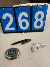 Fountain Pen, Darringer Cap Gun ,and Belt Buckle