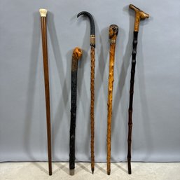 Five American And Continental Carved Wood Walking Sticks And Canes, 19th And 20th Century