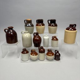 Thirteen American Miniature Glazed Stoneware Jugs & One Redware Example, Late 19th-Early 20th Century