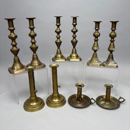 Five Pairs Of English Brass Candlesticks