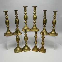 Five Pairs Of English Brass Push-Up Candlesticks, 1897-1940