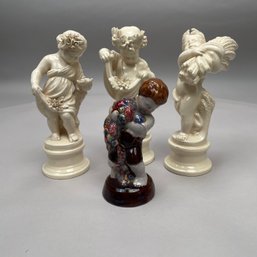 German Glazed Redware Figure Of A Boy, PKK, And A Set Of Three Glazed Faience Figures