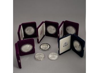 Eight American Eagle One Dollar Coins