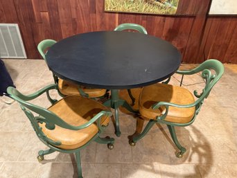 (BASE) MCM CAST IRON BASE GAME TABLE WITH MICA TOP & FOUR MATCHING CHAIRS ON WHEELS - 42' BY 29'H