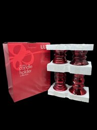 (A-45) NEW IN BOX 4 PIECE ULTA RED CANDLE HOLDERS