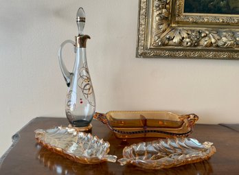 (P-10) COLLECTION OF FOUR VINTAGE GLASS PIECES - PAIR OF AMBER LEAF SERVING DISHES, DECANTER & DIVIDED DISH