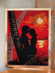 (AR-9) FRAMED NEEDLEPOINT ART, LOVE COUPLE IN FRONT OF THE SETTING SUN- 22' BY 16'