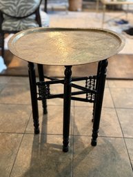 (KIT) VINTAGE WOOD TRAY TABLE WITH ROUND ETCHED BRASS TRAY TOP- AS-IS BRASS IS MISSHAPEN - 22' BY 23'H