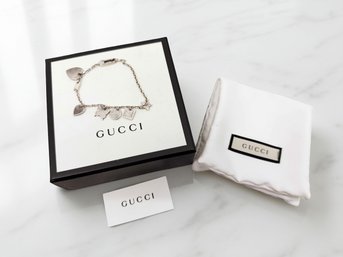 (J-15) GUCCI TRADEMARK MULTI-CHARM STERLING SILVER CHARM BRACELET-BOXED AS SHOWN