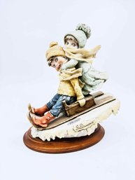)A-46) VINTAGE GIUSEPPE ARMANI PORCELAIN SCULPTURE-WINTER FUN-SIGNED-ITALY-APPROX. 9'T
