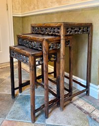 (HALL) VINTAGE CARVED HARDWOOD NESTING TABLES  -TOP HAS GLASS TOP - LARGEST IS 28' BY 20' BY 14'